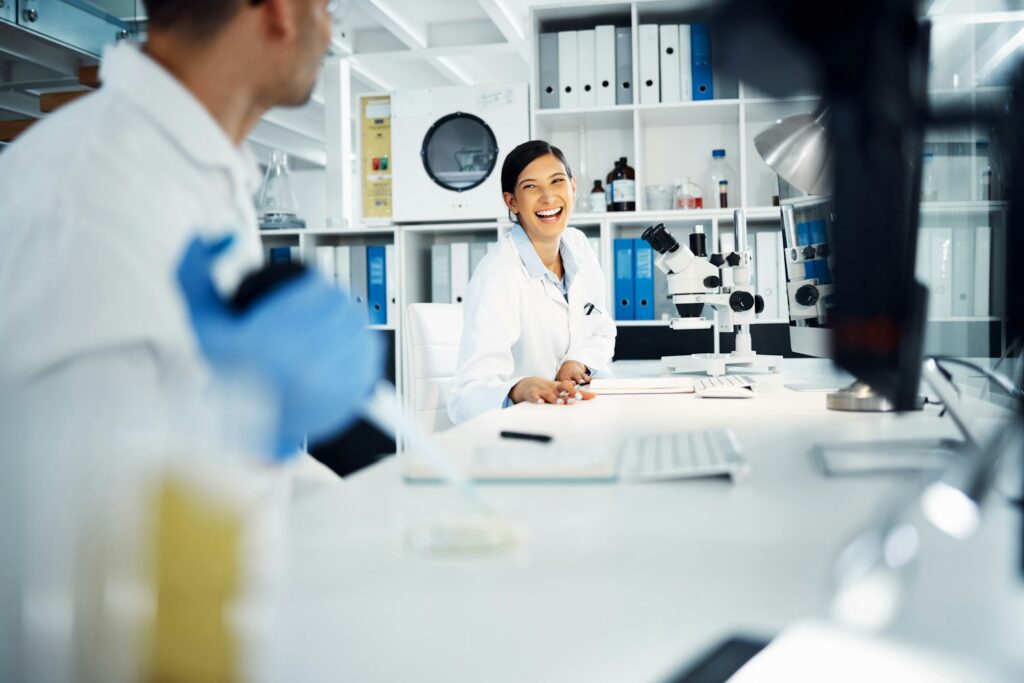 Shot of two young scientists having a discussion while conducting medical research in a laboratory